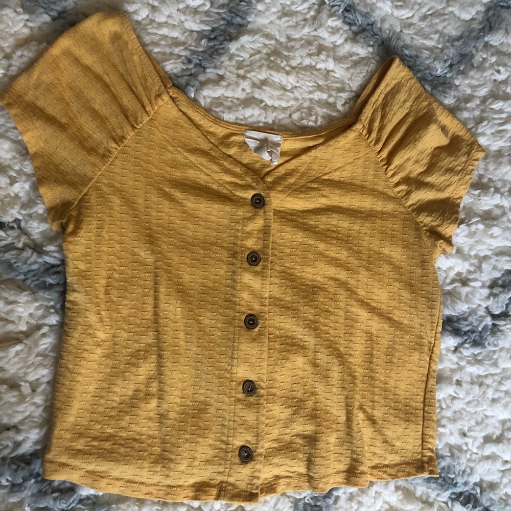 Francesca’s yellow button up blouse